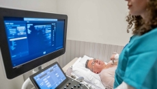 Technician conducting ultrasound exam