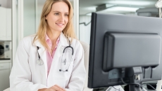 Healthcare provider looking at a computer