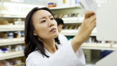 Pharmacist checking a medication package
