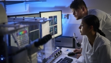 Healthcare professionals looking at telemetry