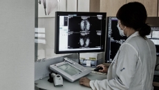 Doctor reviewing mammography findings from AI-powered software