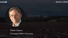 Martin Gaynor, Carnegie Mellon University_Muddy field with hospital in background_Jason Jones Travel Photography/Moment/Getty Images