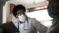 Healthcare provider caring for a patient in their home