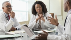 Healthcare professionals conferring
