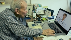 Person interacting with a healthcare professional via a telehealth visit