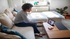 Senior woman on a video telemedicine call with a doctor at home