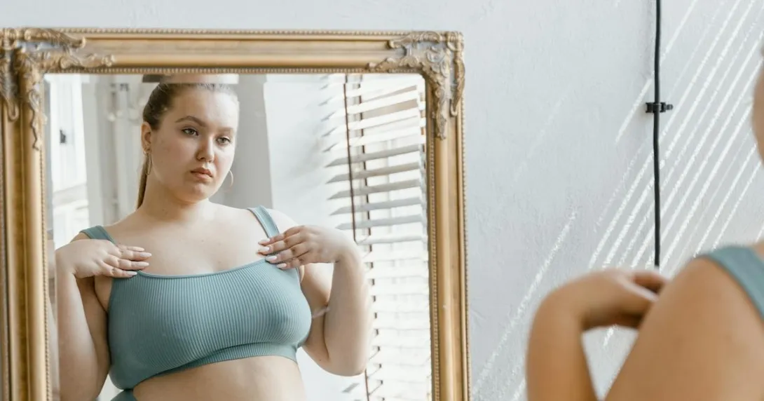 A person looking at their reflection in a mirror