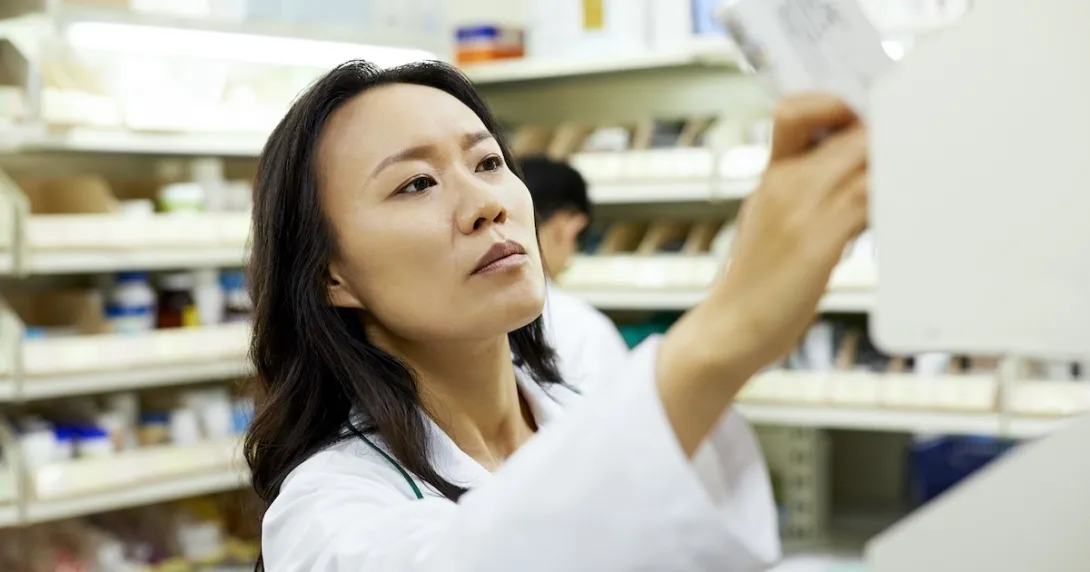 Pharmacist checking a medication package