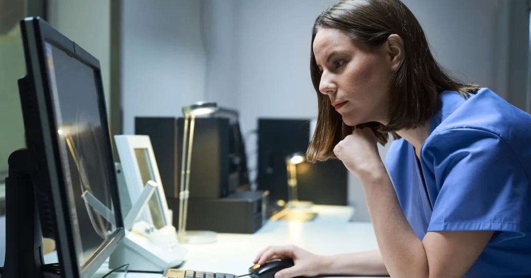 Healthcare professional reviewing data