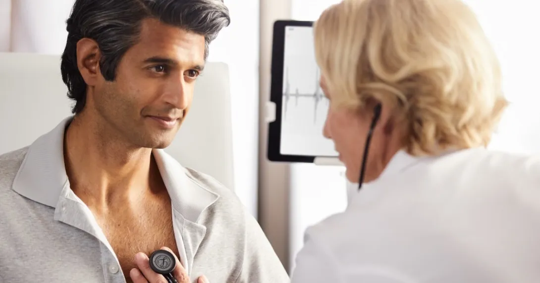 A healthcare professional using an Eko stethoscope with a patient