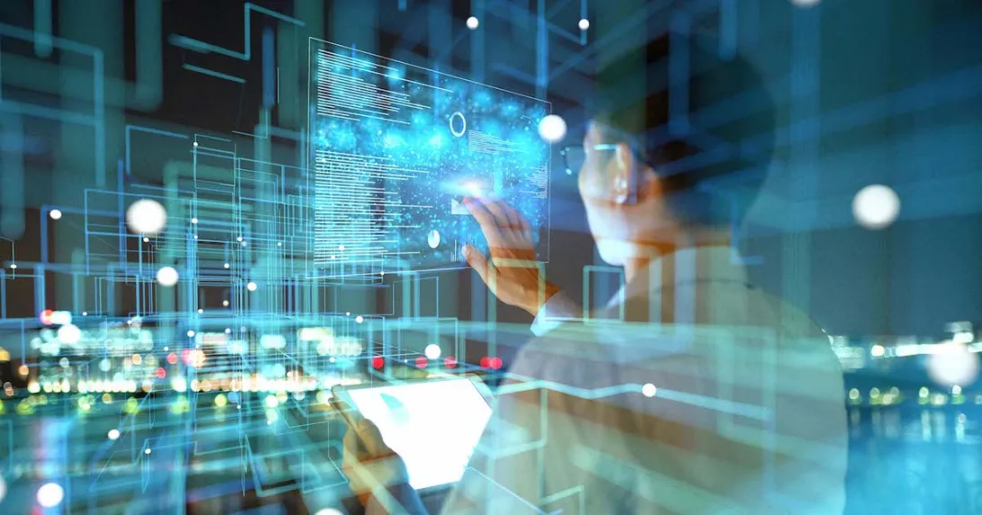 Person looking at images projected onto a wall with a city in the background