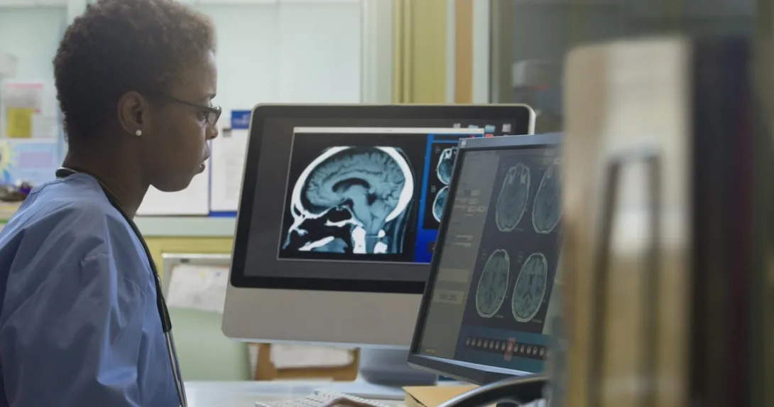 Healthcare professional examining an x-ray