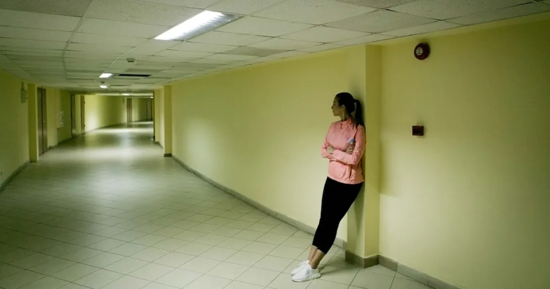 Person standing in the hall of a halfway house