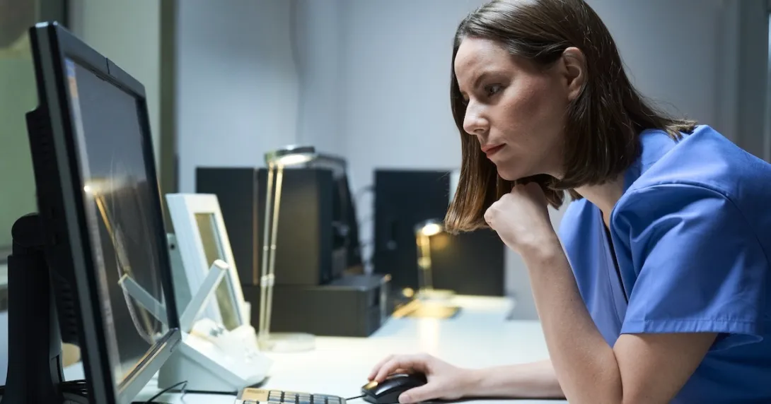 Technician reviewing MRI data