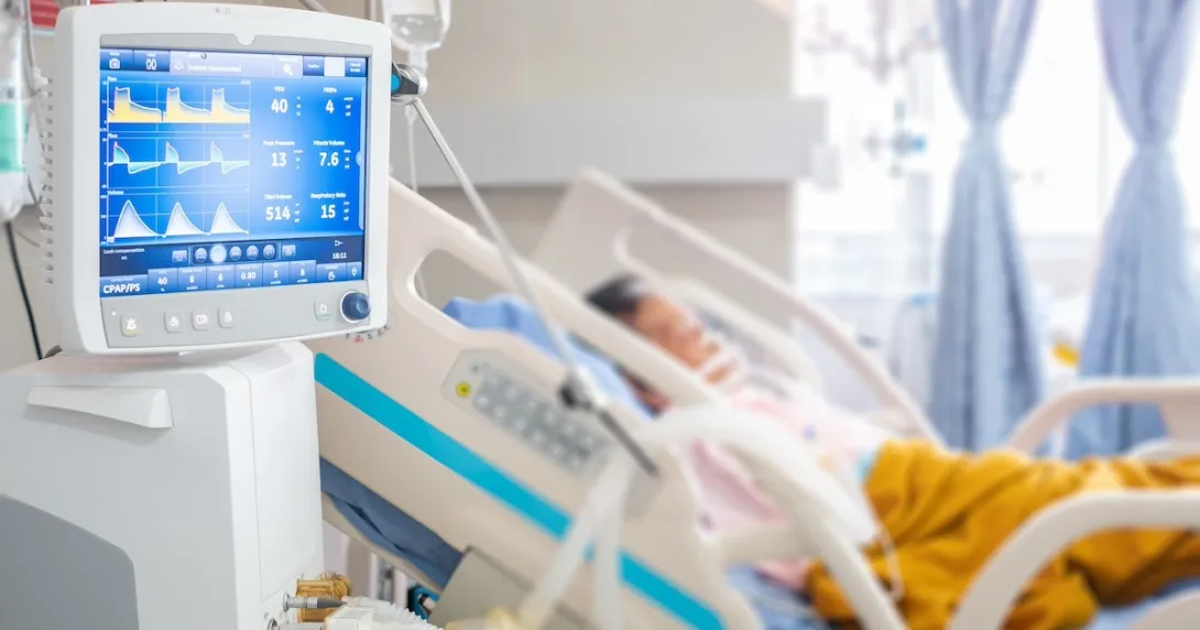 Image of patient in hospital with vital-sign-monitoring device