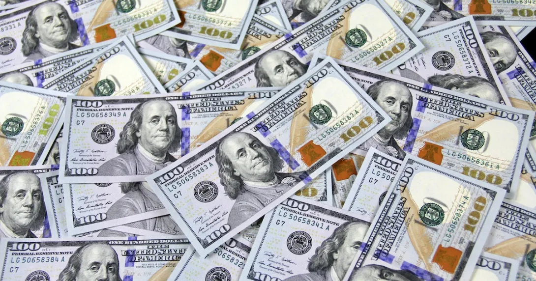 A pile of hundred dollar bills