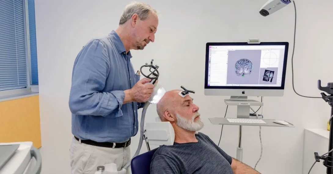 Trial overseer Professor Peter Nestor demonstrating the use of ultrasound in an Alzheimer's treatment session