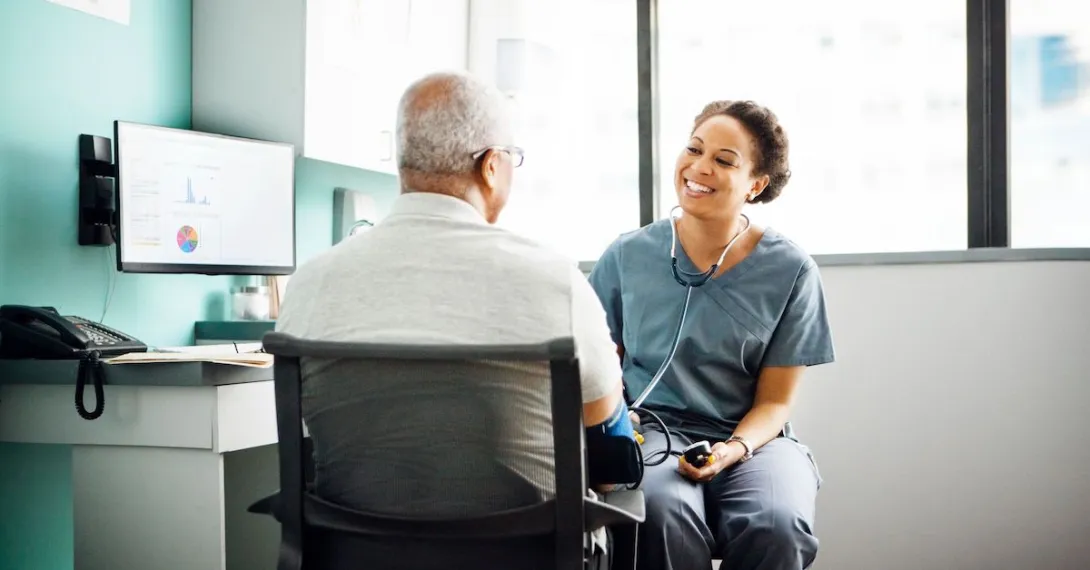 A doctor meeting with a patient.