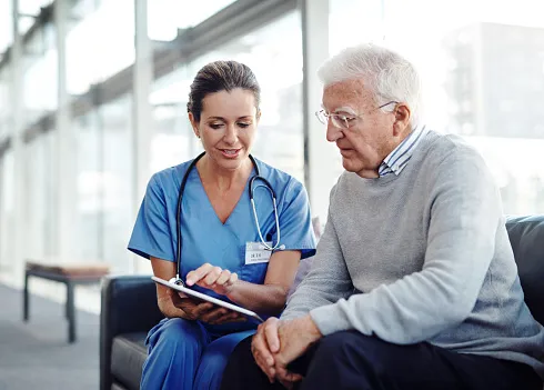 Provider gives options to patient while looking at a tablet or notepad