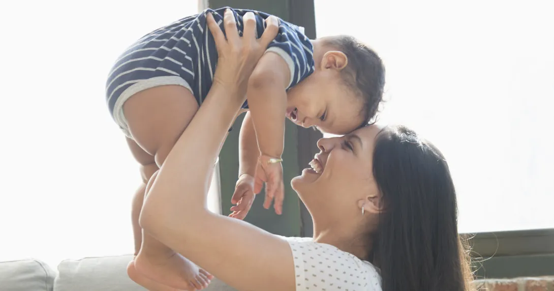 A person holding a baby