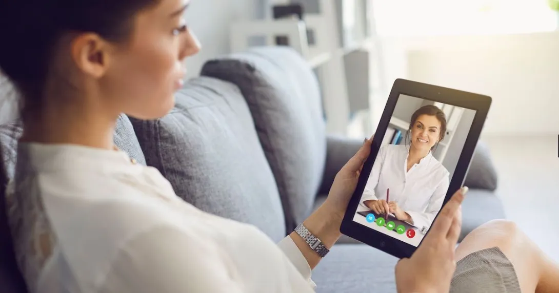 A woman talking to a provider on a video call